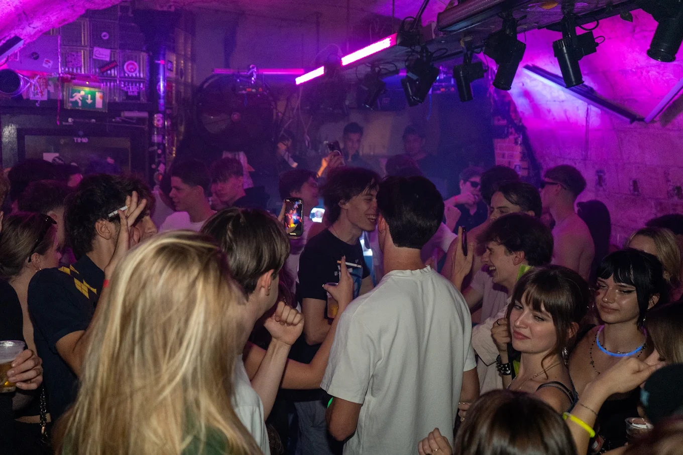 Packed dancefloor at Cavo under purple light